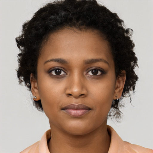 Neutral black young-adult female with short  brown hair and brown eyes