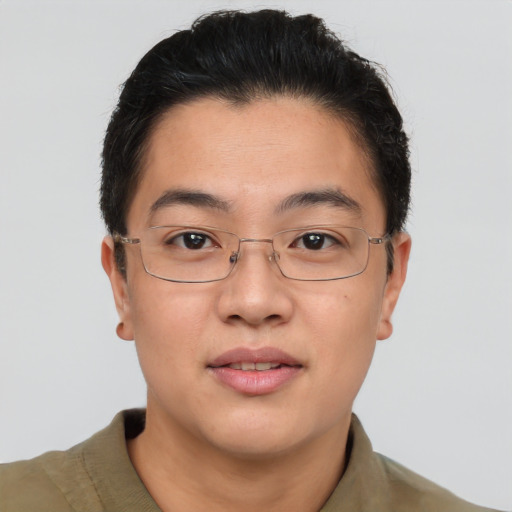 Joyful asian adult male with short  brown hair and brown eyes