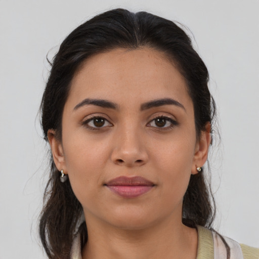 Neutral latino young-adult female with medium  brown hair and brown eyes