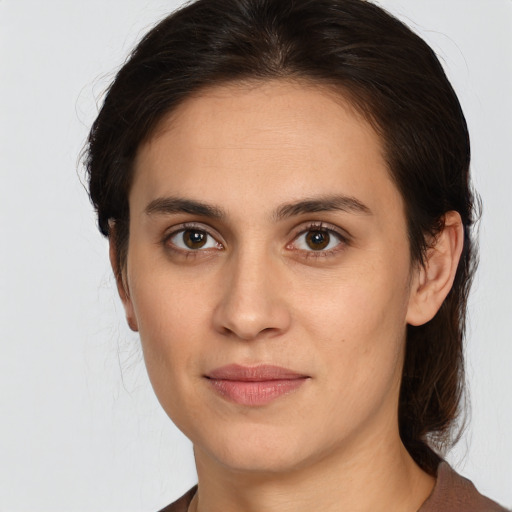 Joyful white young-adult female with medium  brown hair and brown eyes