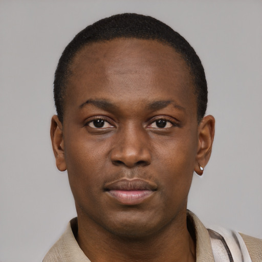 Neutral latino young-adult male with short  brown hair and brown eyes