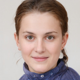 Joyful white child female with short  brown hair and grey eyes