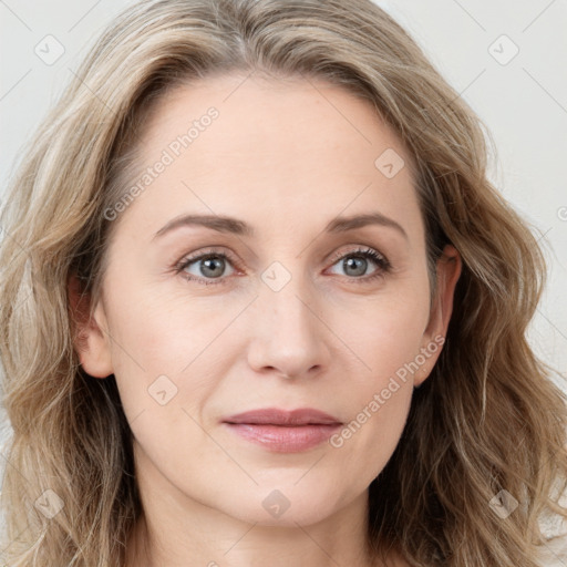 Joyful white young-adult female with long  brown hair and blue eyes