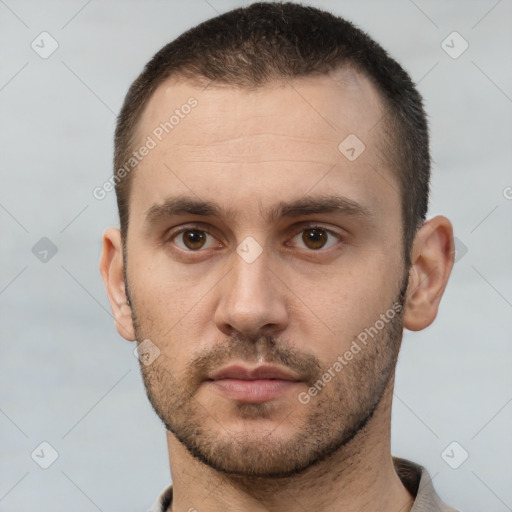 Neutral white young-adult male with short  brown hair and brown eyes