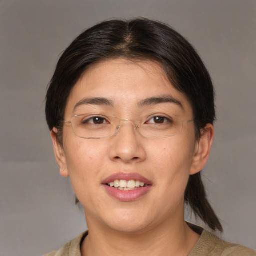 Joyful white adult female with medium  brown hair and brown eyes