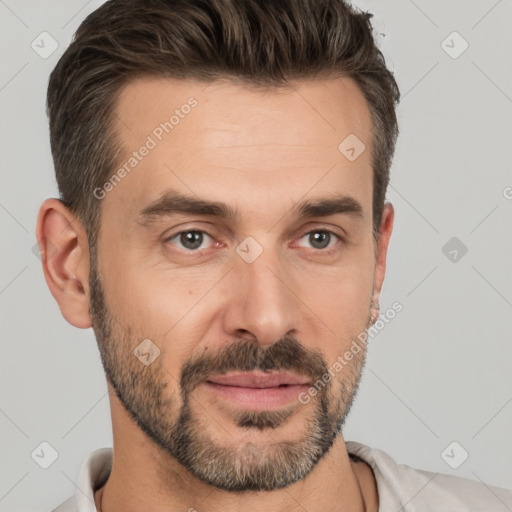 Joyful white adult male with short  brown hair and brown eyes