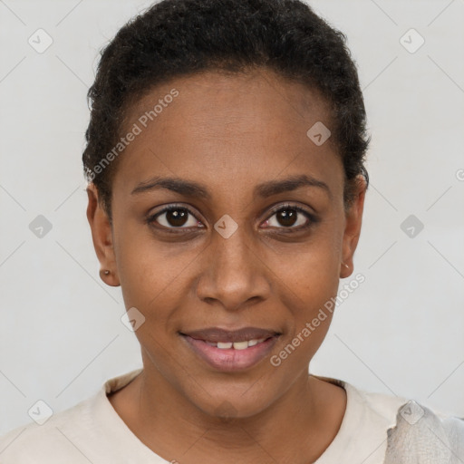 Joyful black young-adult female with short  brown hair and brown eyes