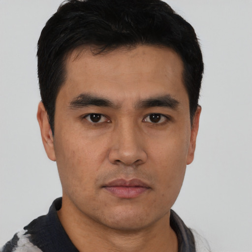 Neutral asian young-adult male with short  black hair and brown eyes