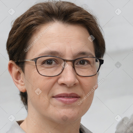 Joyful white adult female with short  brown hair and grey eyes