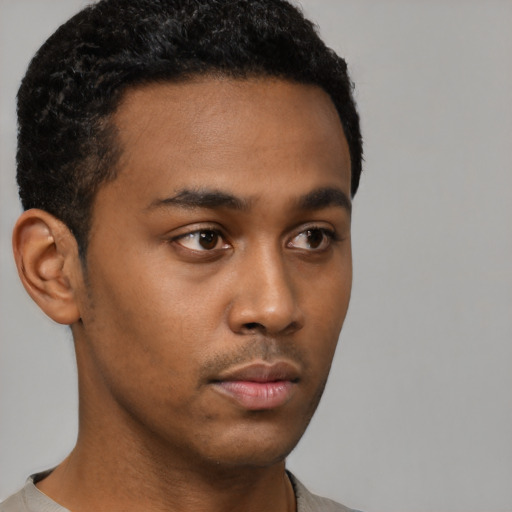 Neutral latino young-adult male with short  brown hair and brown eyes