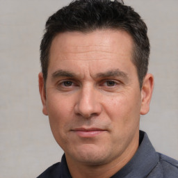 Neutral white adult male with short  black hair and brown eyes