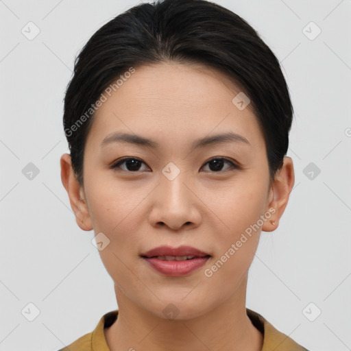 Joyful asian young-adult female with short  brown hair and brown eyes