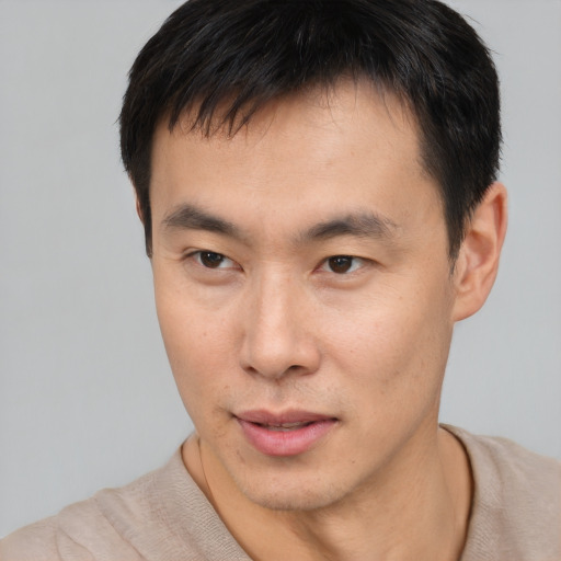 Neutral asian young-adult male with short  brown hair and brown eyes