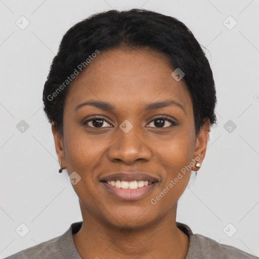 Joyful black young-adult female with short  black hair and brown eyes