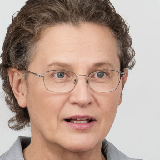 Joyful white middle-aged female with short  brown hair and grey eyes