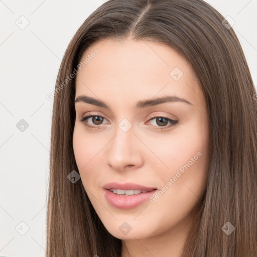 Neutral white young-adult female with long  brown hair and brown eyes