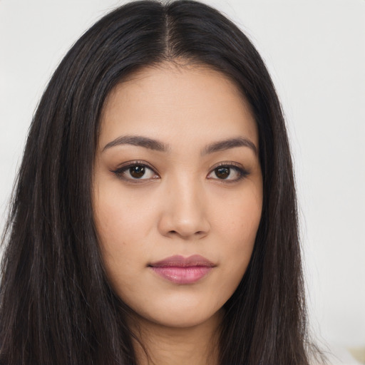 Neutral latino young-adult female with long  brown hair and brown eyes
