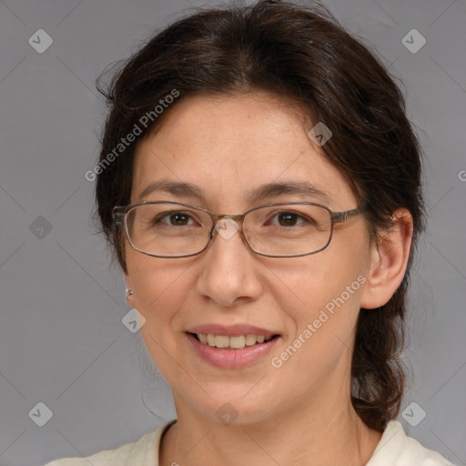 Joyful white adult female with medium  brown hair and brown eyes