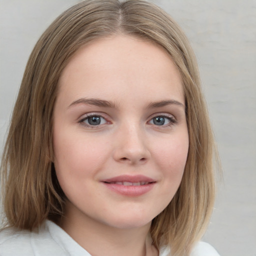 Joyful white child female with medium  brown hair and brown eyes