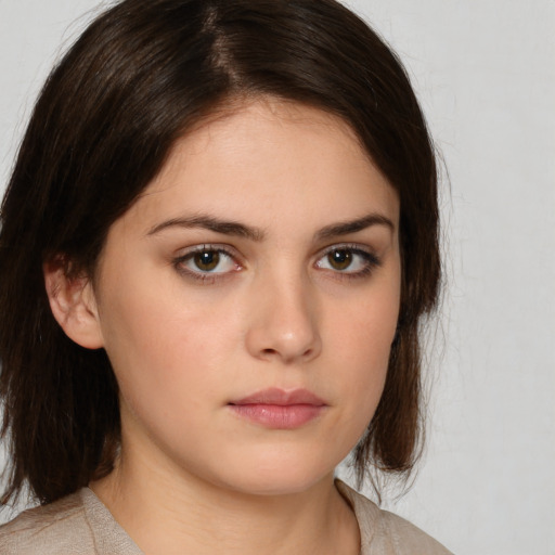 Neutral white young-adult female with medium  brown hair and brown eyes