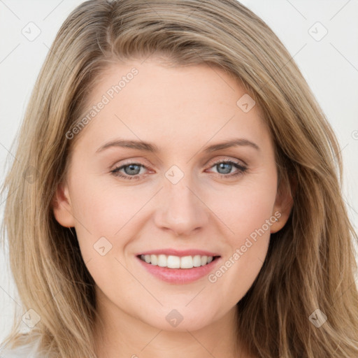 Joyful white young-adult female with long  brown hair and blue eyes