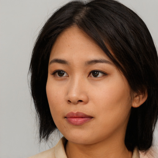 Neutral asian young-adult female with medium  black hair and brown eyes