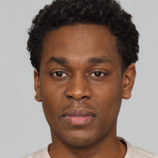 Neutral black young-adult male with short  brown hair and brown eyes