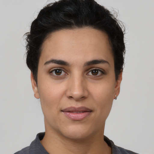 Joyful white young-adult female with short  brown hair and brown eyes