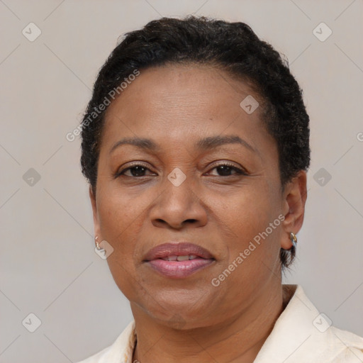 Joyful black adult female with short  brown hair and brown eyes