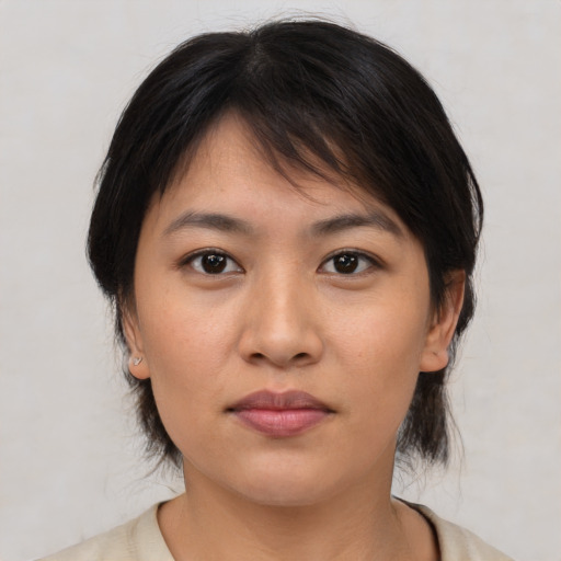 Neutral asian young-adult female with medium  brown hair and brown eyes