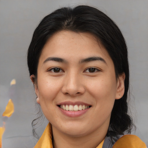 Joyful asian young-adult female with medium  brown hair and brown eyes