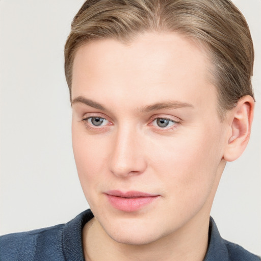 Joyful white young-adult female with short  brown hair and blue eyes