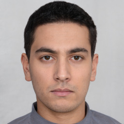 Neutral white young-adult male with short  black hair and brown eyes
