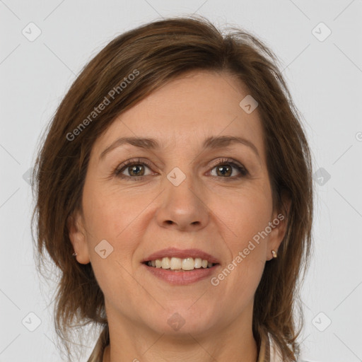 Joyful white adult female with medium  brown hair and grey eyes