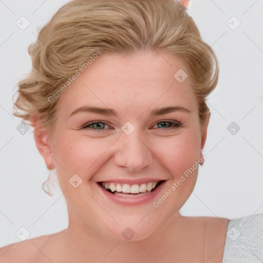 Joyful white young-adult female with short  brown hair and blue eyes