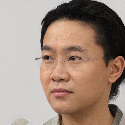 Neutral asian adult male with short  black hair and brown eyes