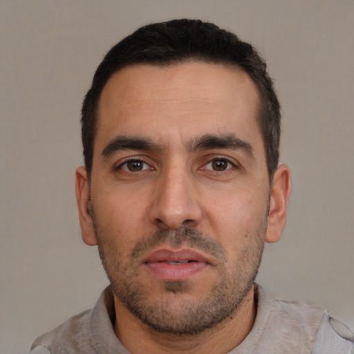 Neutral white adult male with short  black hair and brown eyes