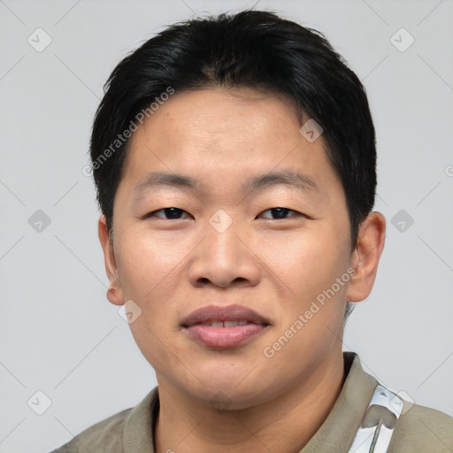 Joyful asian young-adult male with short  black hair and brown eyes