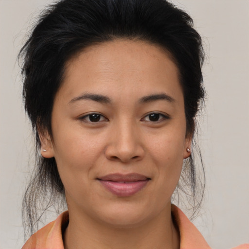 Joyful asian young-adult female with medium  brown hair and brown eyes