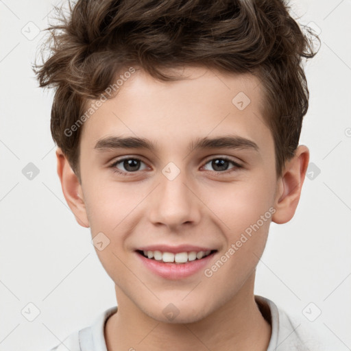 Joyful white child male with short  brown hair and brown eyes