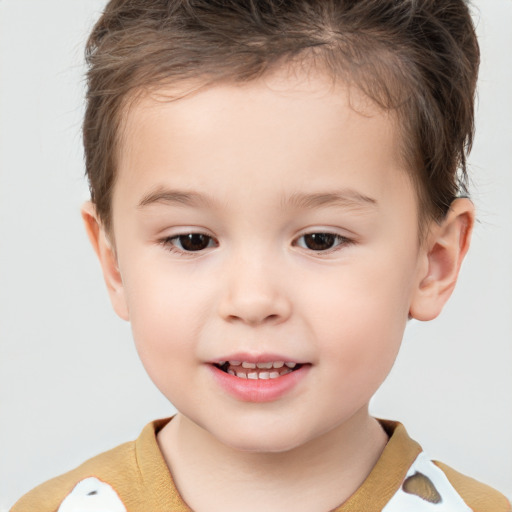 Joyful white child male with short  brown hair and brown eyes