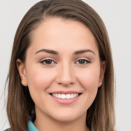 Joyful white young-adult female with long  brown hair and grey eyes