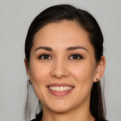 Joyful white young-adult female with medium  brown hair and brown eyes