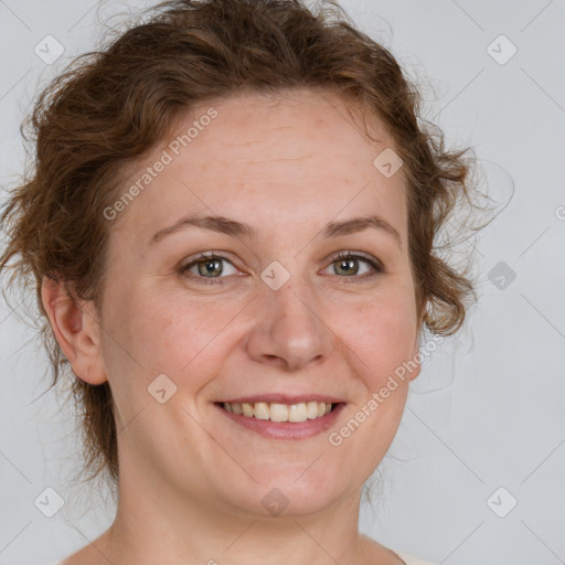 Joyful white adult female with medium  brown hair and blue eyes