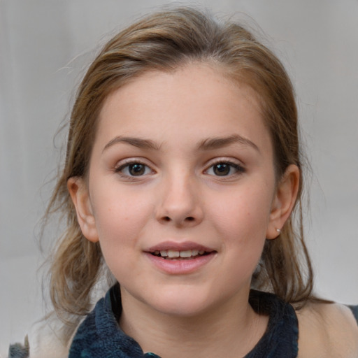 Joyful white child female with medium  brown hair and grey eyes