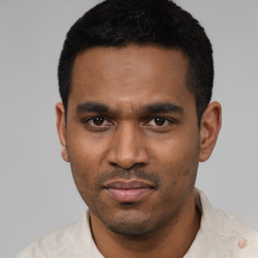 Neutral latino young-adult male with short  black hair and brown eyes