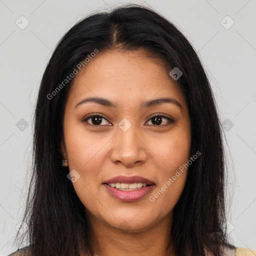 Joyful latino young-adult female with long  brown hair and brown eyes