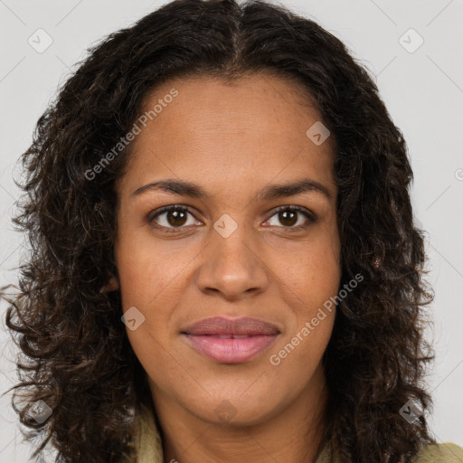 Joyful black young-adult female with long  brown hair and brown eyes