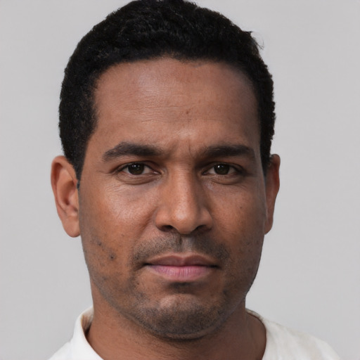 Neutral latino young-adult male with short  black hair and brown eyes