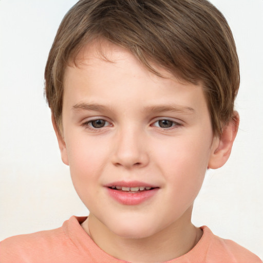 Joyful white child male with short  brown hair and brown eyes